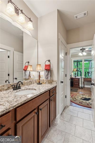 bathroom with vanity and ceiling fan
