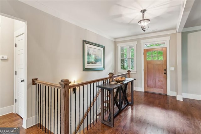 entryway featuring wood finished floors and baseboards