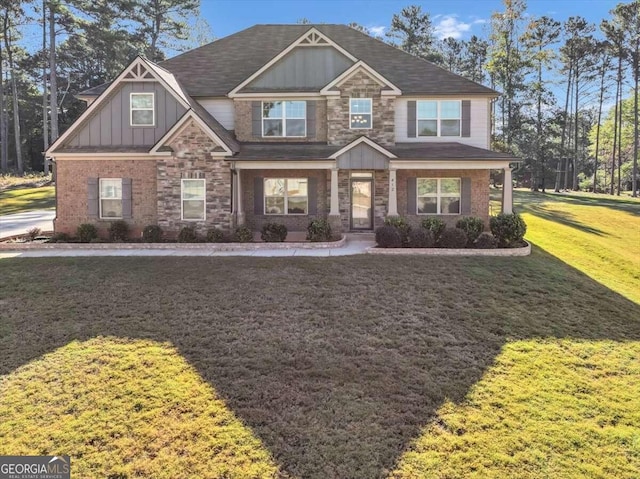 craftsman-style home featuring a front lawn, stone siding, and board and batten siding
