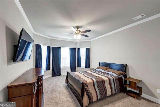 bedroom featuring light colored carpet, visible vents, and ornamental molding