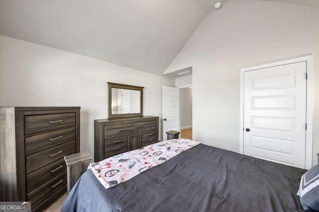 bedroom with lofted ceiling