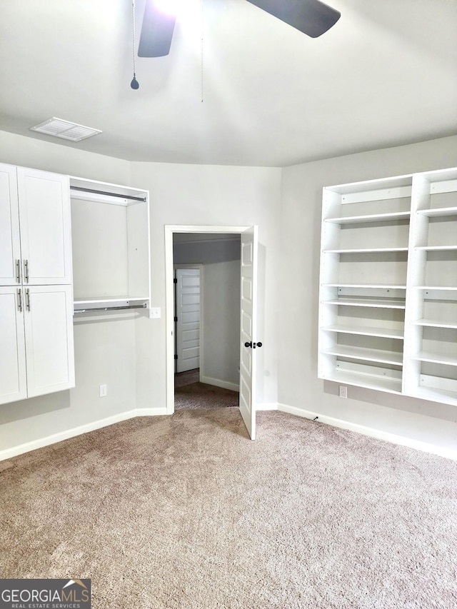 unfurnished bedroom with baseboards, visible vents, a closet, and carpet