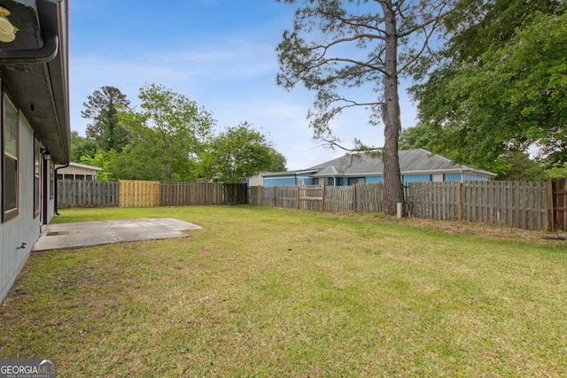 view of yard featuring a patio and a fenced backyard