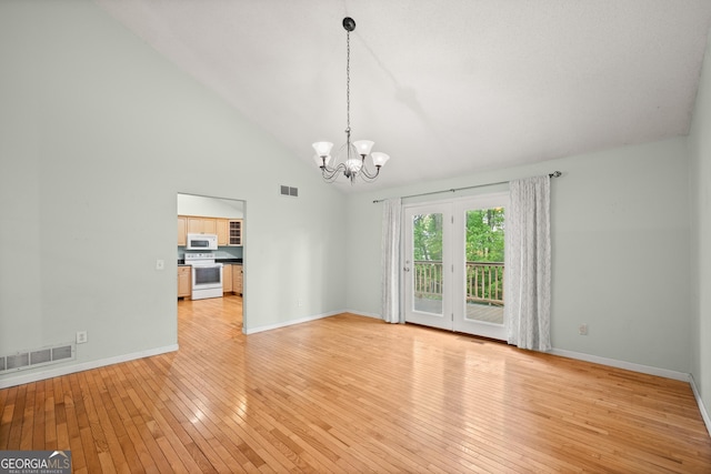 3592 Lakeview Dr, Gainesville, GA 30501 - spare room with an inviting chandelier, visible vents, high vaulted ceiling, and light wood-style floors