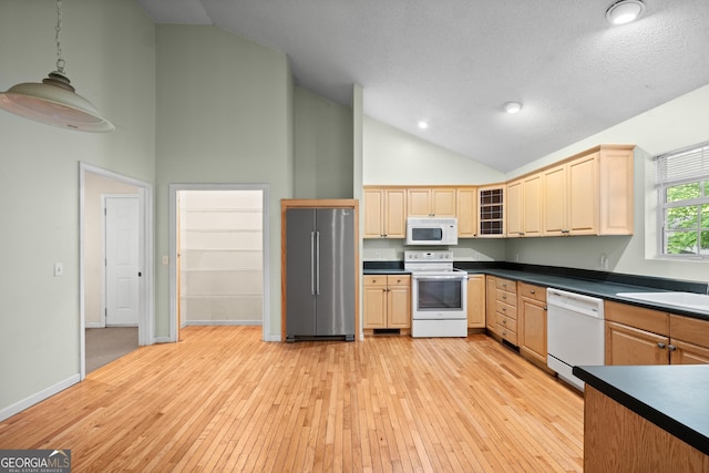 3592 Lakeview Dr, Gainesville, GA 30501 - kitchen featuring white appliances, light brown cabinetry, dark countertops, light wood-type flooring, and high vaulted ceiling