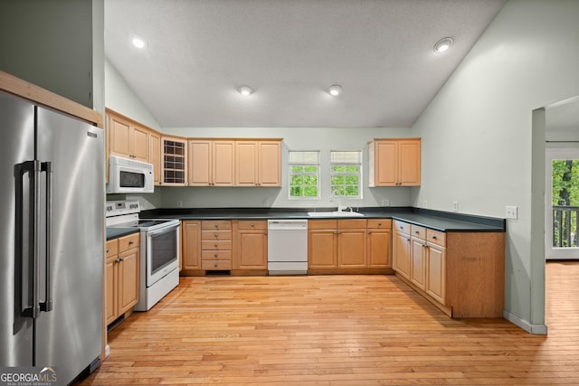 3592 Lakeview Dr, Gainesville, GA 30501 - kitchen featuring light wood-style flooring, light brown cabinetry, vaulted ceiling, and white appliances