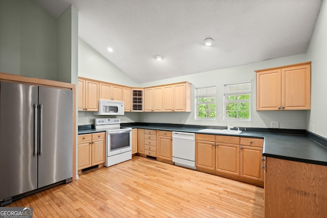 3592 Lakeview Dr, Gainesville, GA 30501 - kitchen with a sink, light brown cabinets, light wood-type flooring, white appliances, and dark countertops