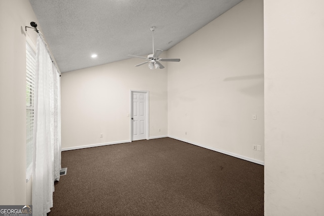 3592 Lakeview Dr, Gainesville, GA 30501 - empty room with dark colored carpet, ceiling fan, baseboards, visible vents, and lofted ceiling