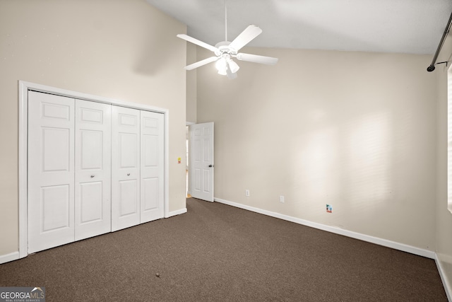 3592 Lakeview Dr, Gainesville, GA 30501 - unfurnished bedroom with dark colored carpet, ceiling fan, a closet, baseboards, and high vaulted ceiling