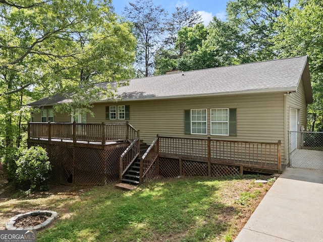 3592 Lakeview Dr, Gainesville, GA 30501 - back of house featuring a garage, stairway, a yard, driveway, and a deck