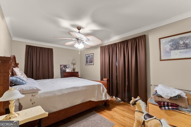 5855 Willis Ln, Cumming, GA 30040 - bedroom with ornamental molding, ceiling fan, and light wood-style flooring