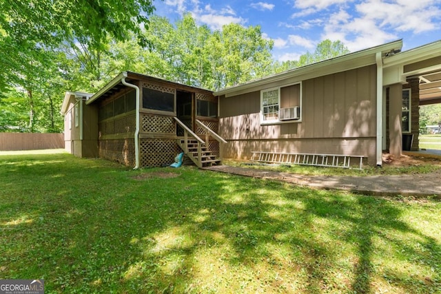 5855 Willis Ln, Cumming, GA 30040 - back of property with a lawn, fence, and a sunroom