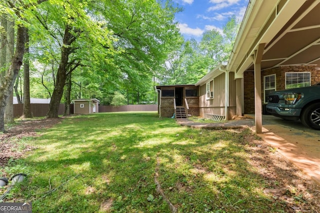 5855 Willis Ln, Cumming, GA 30040 - view of yard with fence, a storage shed, and an outbuilding