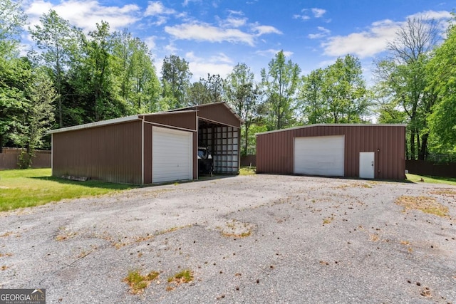 5855 Willis Ln, Cumming, GA 30040 - garage featuring a garage and fence