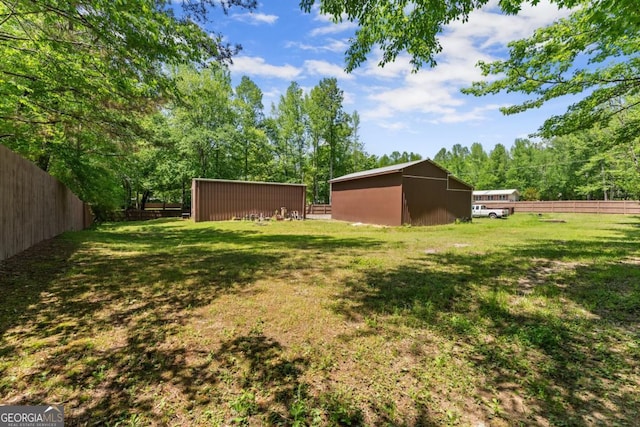 5855 Willis Ln, Cumming, GA 30040 - view of yard with fence, an outdoor structure, and a pole building