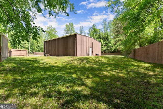 5855 Willis Ln, Cumming, GA 30040 - view of yard with a fenced backyard, an outbuilding, and an outdoor structure