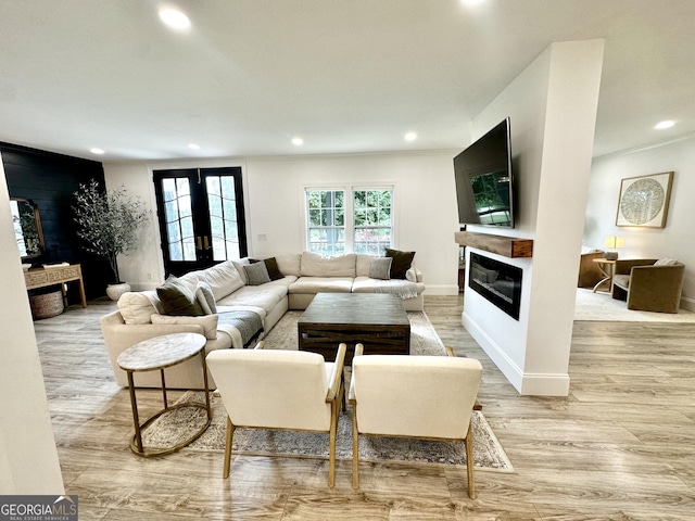 3550 N Bogan Rd, Buford, GA 30519 - living room featuring a glass covered fireplace, recessed lighting, and light wood finished floors