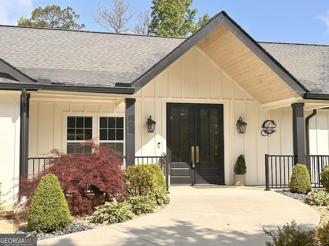 3550 N Bogan Rd, Buford, GA 30519 - doorway to property featuring a shingled roof, board and batten siding, a porch, and french doors