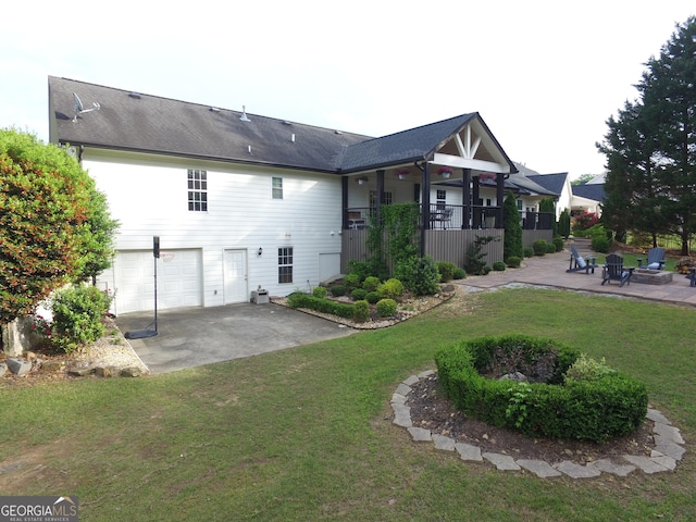 3550 N Bogan Rd, Buford, GA 30519 - back of property featuring a patio area, an attached garage, and a lawn