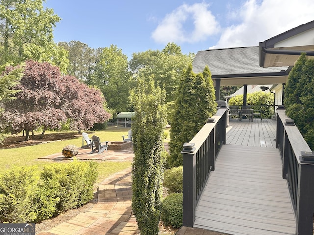 3550 N Bogan Rd, Buford, GA 30519 - deck featuring an outdoor fire pit, a yard, and a patio area