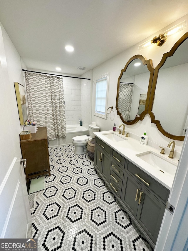 3550 N Bogan Rd, Buford, GA 30519 - full bath featuring double vanity, shower / bath combo, toilet, tile patterned flooring, and recessed lighting