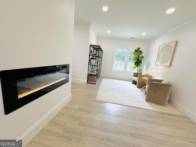 3550 N Bogan Rd, Buford, GA 30519 - living area with baseboards, recessed lighting, light wood-style flooring, and ornamental molding