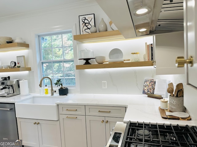kitchen with dishwasher, open shelves, crown molding, and a sink