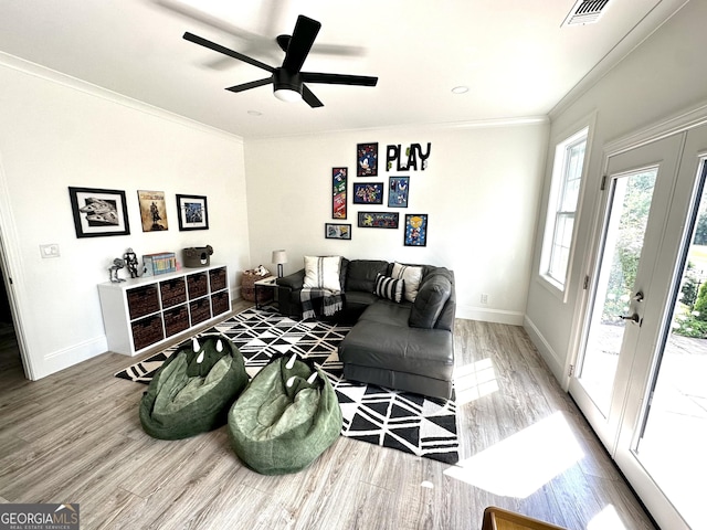 3550 N Bogan Rd, Buford, GA 30519 - living area with wood finished floors, crown molding, baseboards, and a ceiling fan