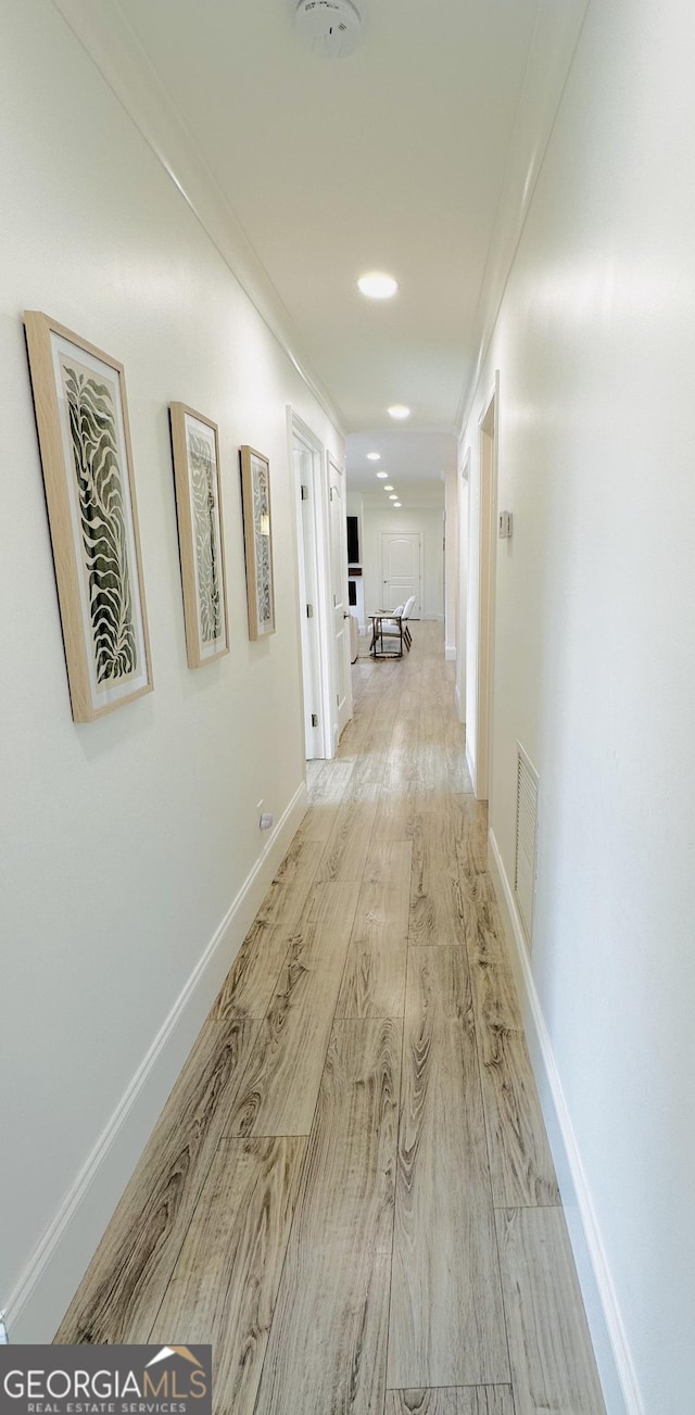 3550 N Bogan Rd, Buford, GA 30519 - hall with light wood-style flooring, baseboards, ornamental molding, and recessed lighting