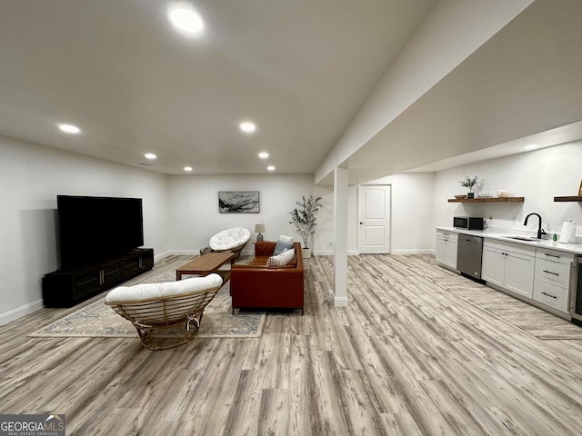 living room featuring light wood-type flooring, recessed lighting, and baseboards