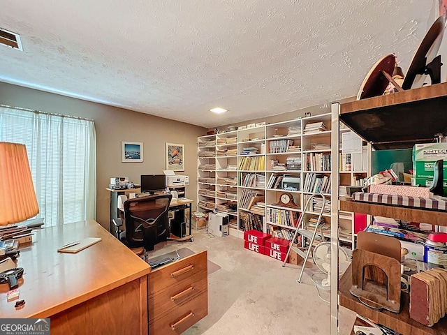 office space featuring a textured ceiling and visible vents