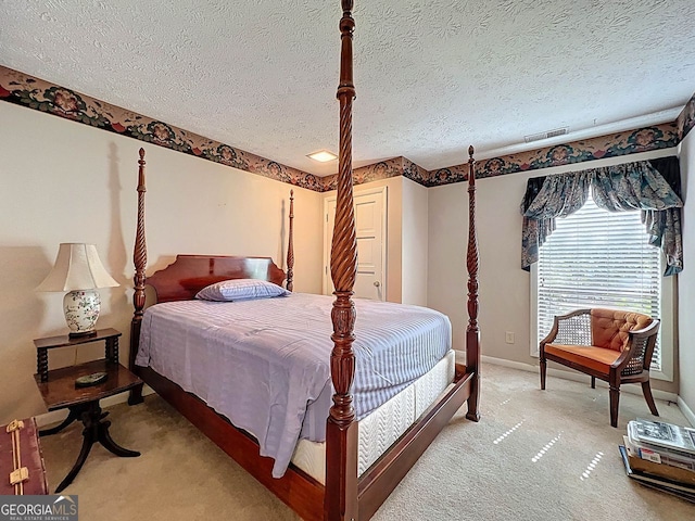 bedroom featuring visible vents, a textured ceiling, baseboards, and light carpet