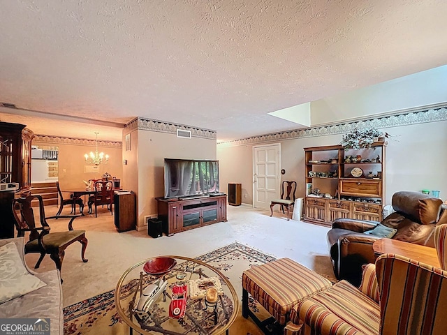 living area featuring carpet floors, a textured ceiling, a notable chandelier, and visible vents