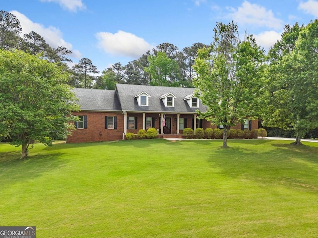 145 Havenbrooke Ct, Fayetteville, GA 30214 - cape cod home featuring brick siding, a porch, and a front lawn