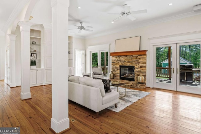 145 Havenbrooke Ct, Fayetteville, GA 30214 - living room featuring ornamental molding, light wood finished floors, ceiling fan, and ornate columns