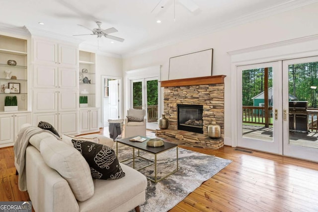 145 Havenbrooke Ct, Fayetteville, GA 30214 - living area with crown molding, light wood finished floors, ceiling fan, and french doors