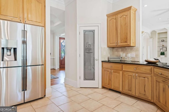 145 Havenbrooke Ct, Fayetteville, GA 30214 - kitchen with light tile patterned floors, decorative backsplash, crown molding, and stainless steel fridge