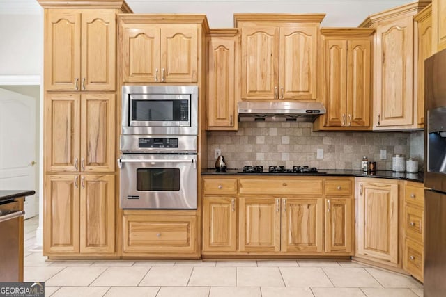 145 Havenbrooke Ct, Fayetteville, GA 30214 - kitchen featuring light brown cabinets, decorative backsplash, stainless steel appliances, under cabinet range hood, and light tile patterned flooring