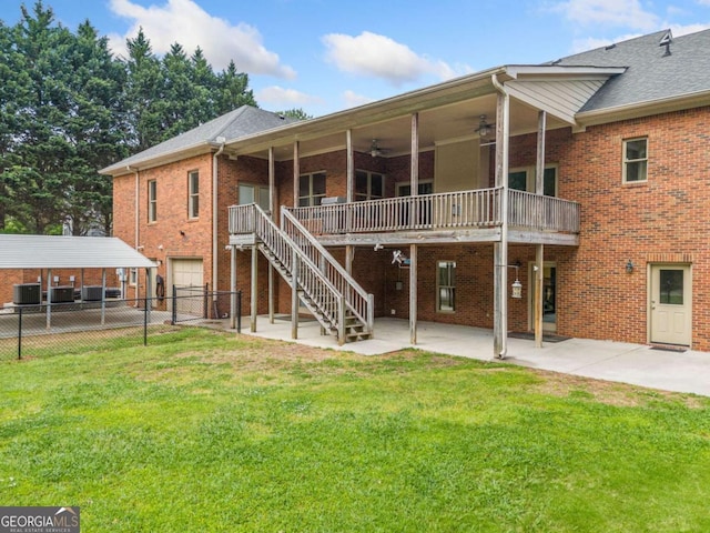 145 Havenbrooke Ct, Fayetteville, GA 30214 - back of house with fence, ceiling fan, brick siding, and a yard