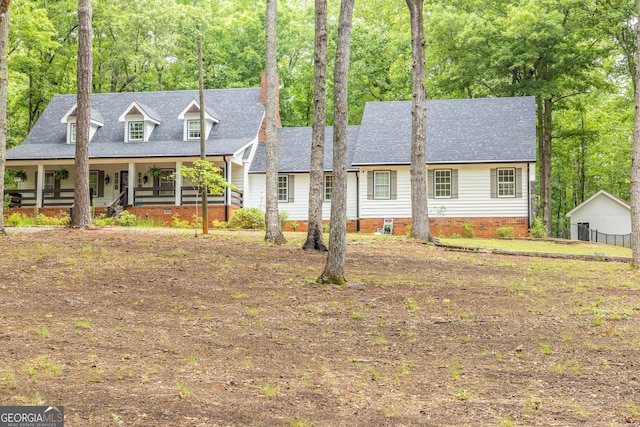 cape cod home featuring a porch, crawl space, and a shingled roof