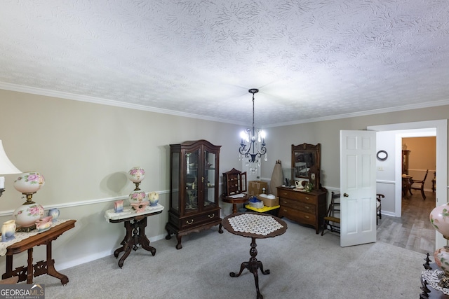 interior space featuring carpet flooring, a textured ceiling, a chandelier, baseboards, and ornamental molding