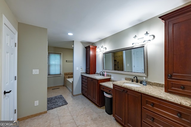 bathroom featuring a sink, recessed lighting, a bath, and two vanities