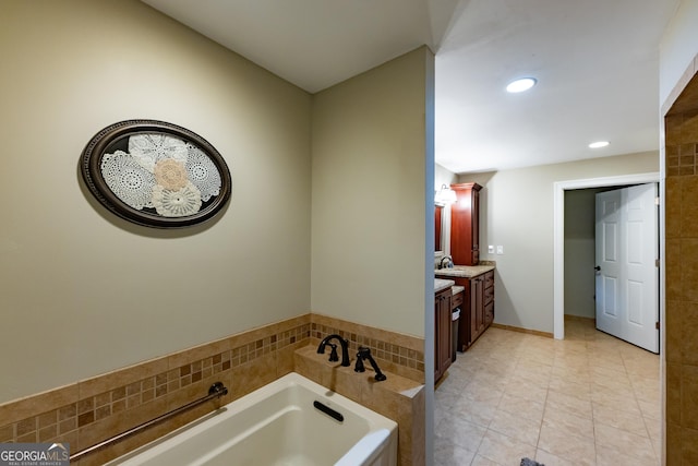full bathroom featuring recessed lighting, tile patterned flooring, a garden tub, and vanity