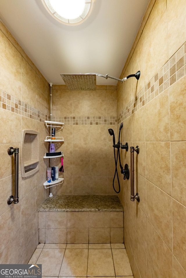 bathroom featuring tile patterned floors and tiled shower