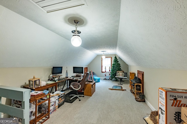 office space featuring baseboards, carpet flooring, a textured ceiling, and lofted ceiling