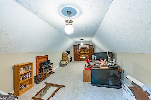 office with vaulted ceiling, baseboards, carpet flooring, and a textured ceiling