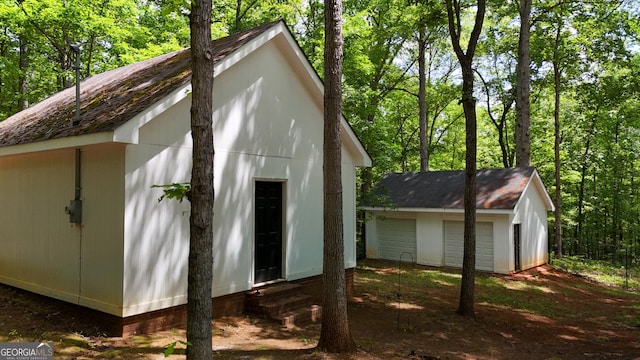 view of outbuilding featuring an outbuilding and entry steps