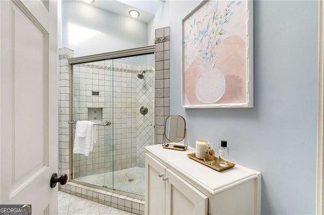 bathroom featuring a shower stall