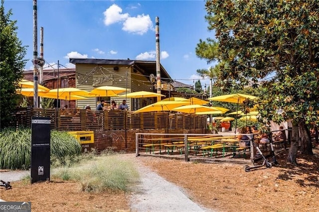view of property's community featuring fence