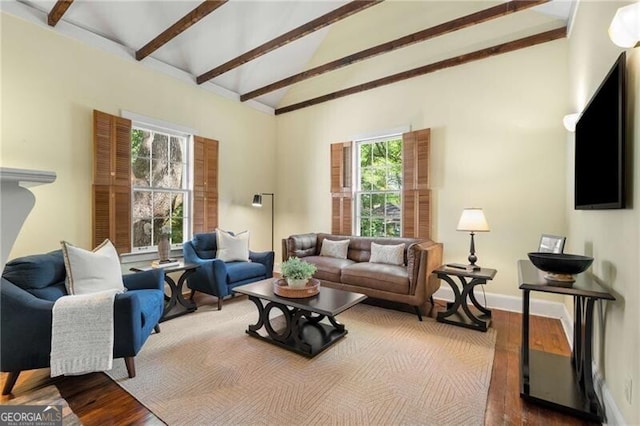 living room with baseboards, beam ceiling, wood finished floors, and high vaulted ceiling